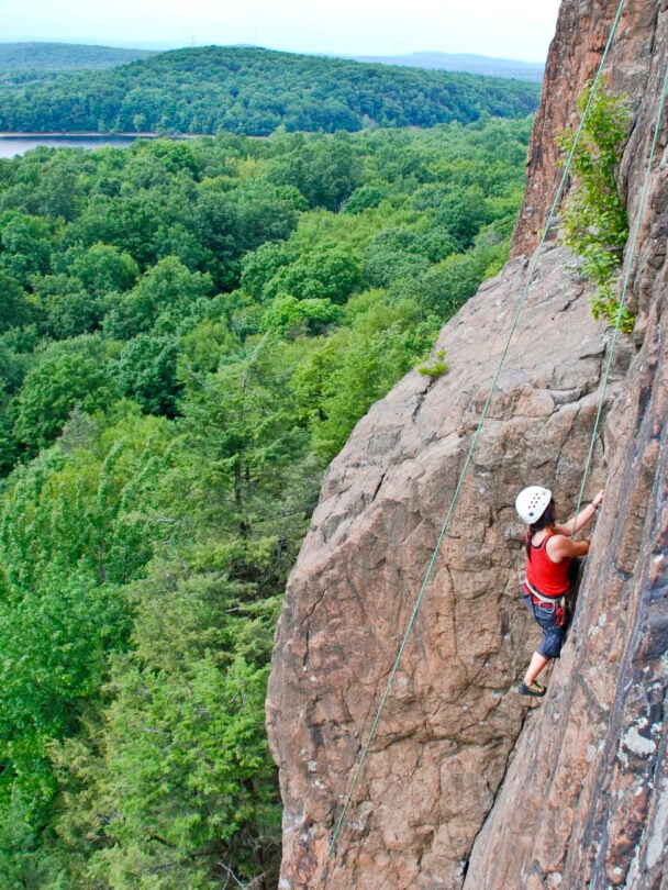 A person rock climbing in Ragged Mountains