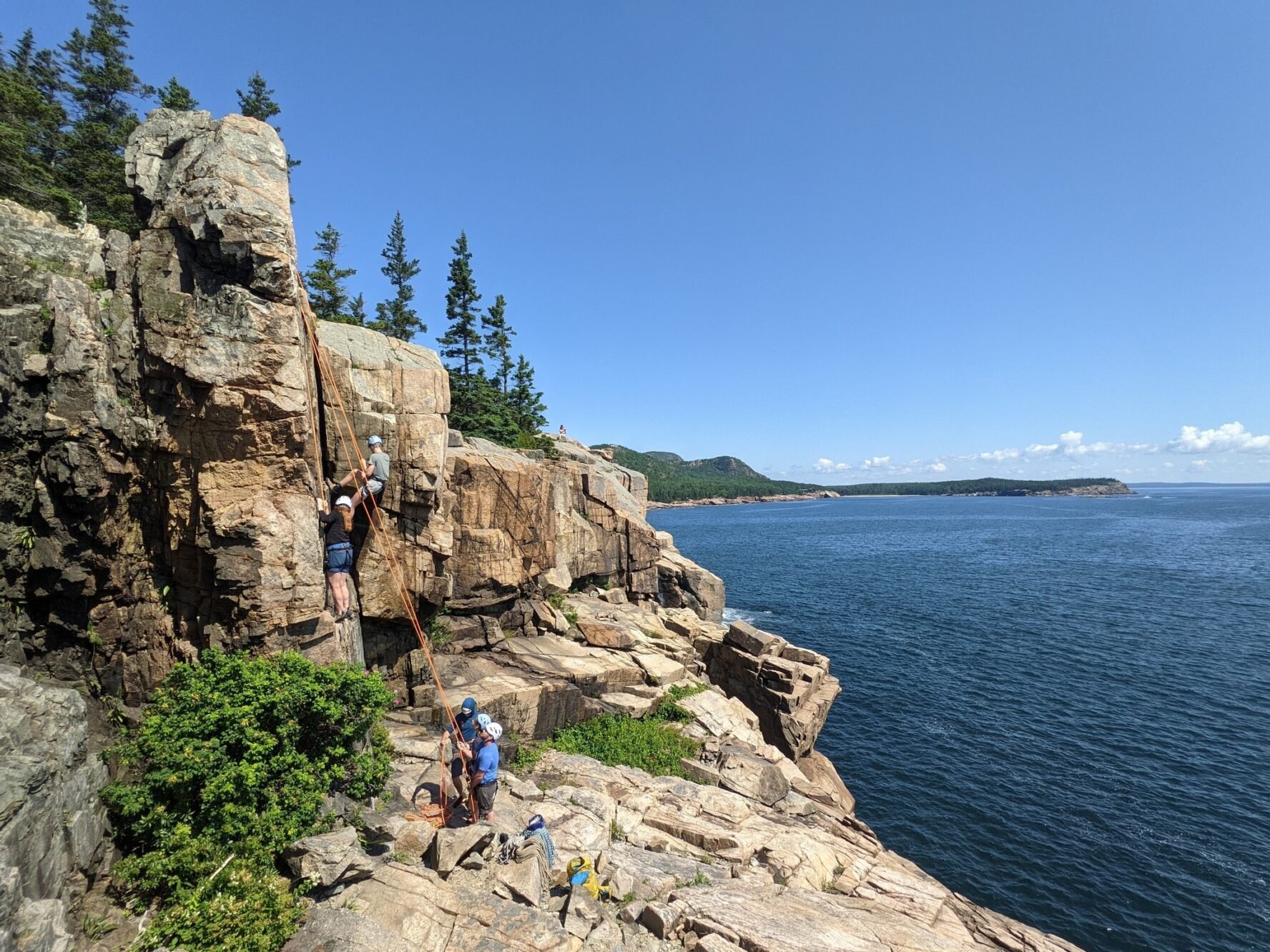 Climbers on a wall in Acadia National Park