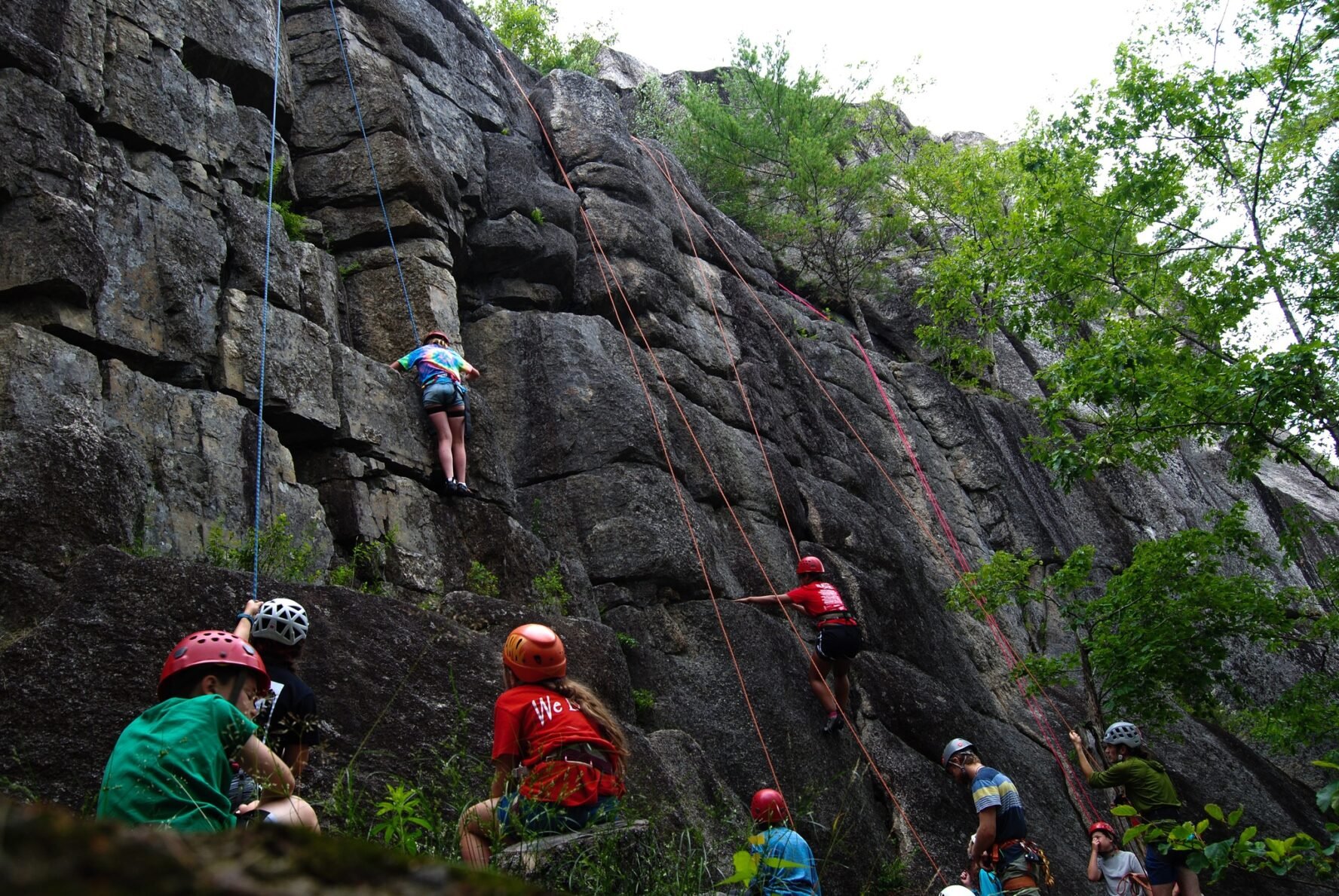 Kids learning to climb on a wall in Acadia National Park