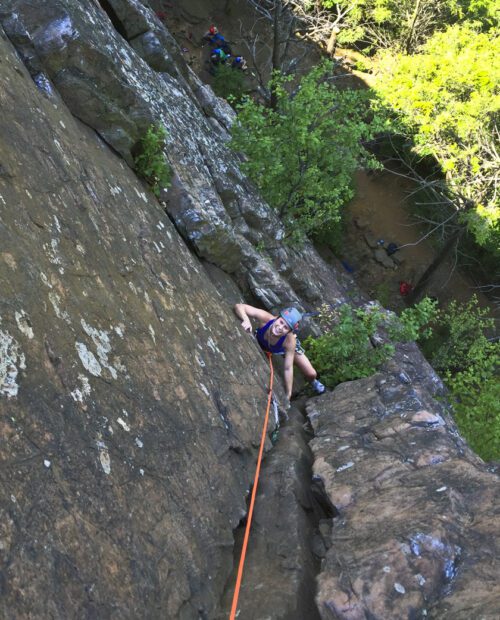 A person rock climbing in Ragged Mountains