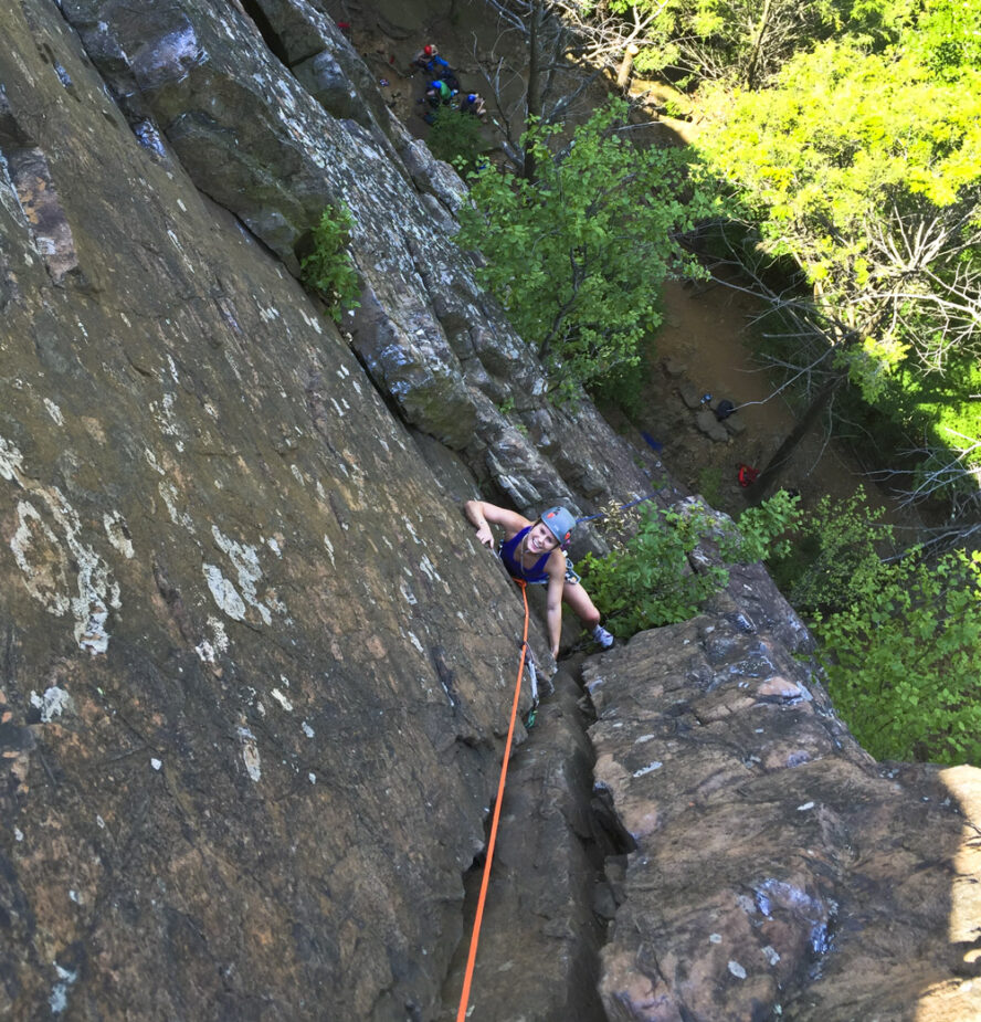 A person rock climbing in Ragged Mountains