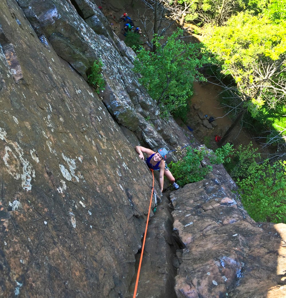 A person rock climbing in Ragged Mountains