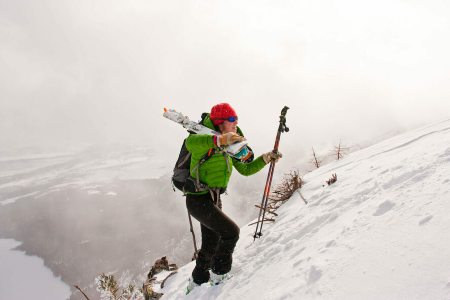 Female ski mountaineer booting up Albright Peak, Grand Teton National Park