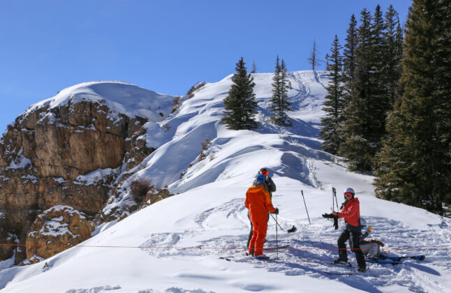 A ski crew psyched to hit some backcountry slopes around Aspen.