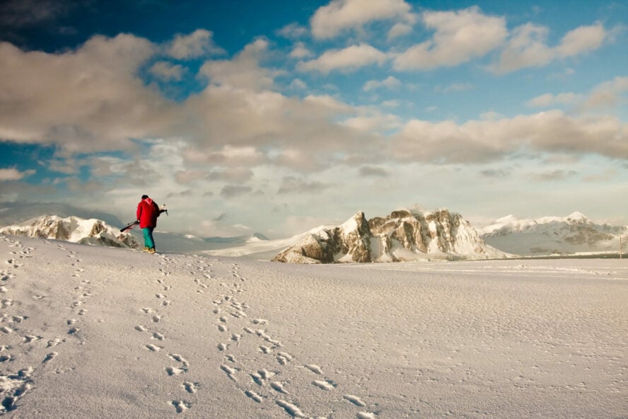 Lone man with skis in Antarcrtica