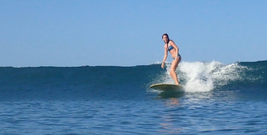 The author, Rebecca Parsons, surfing in Nosara.