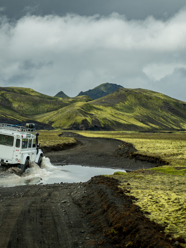Group admiring the breathtaking scenery of a crater in Rauðibötn