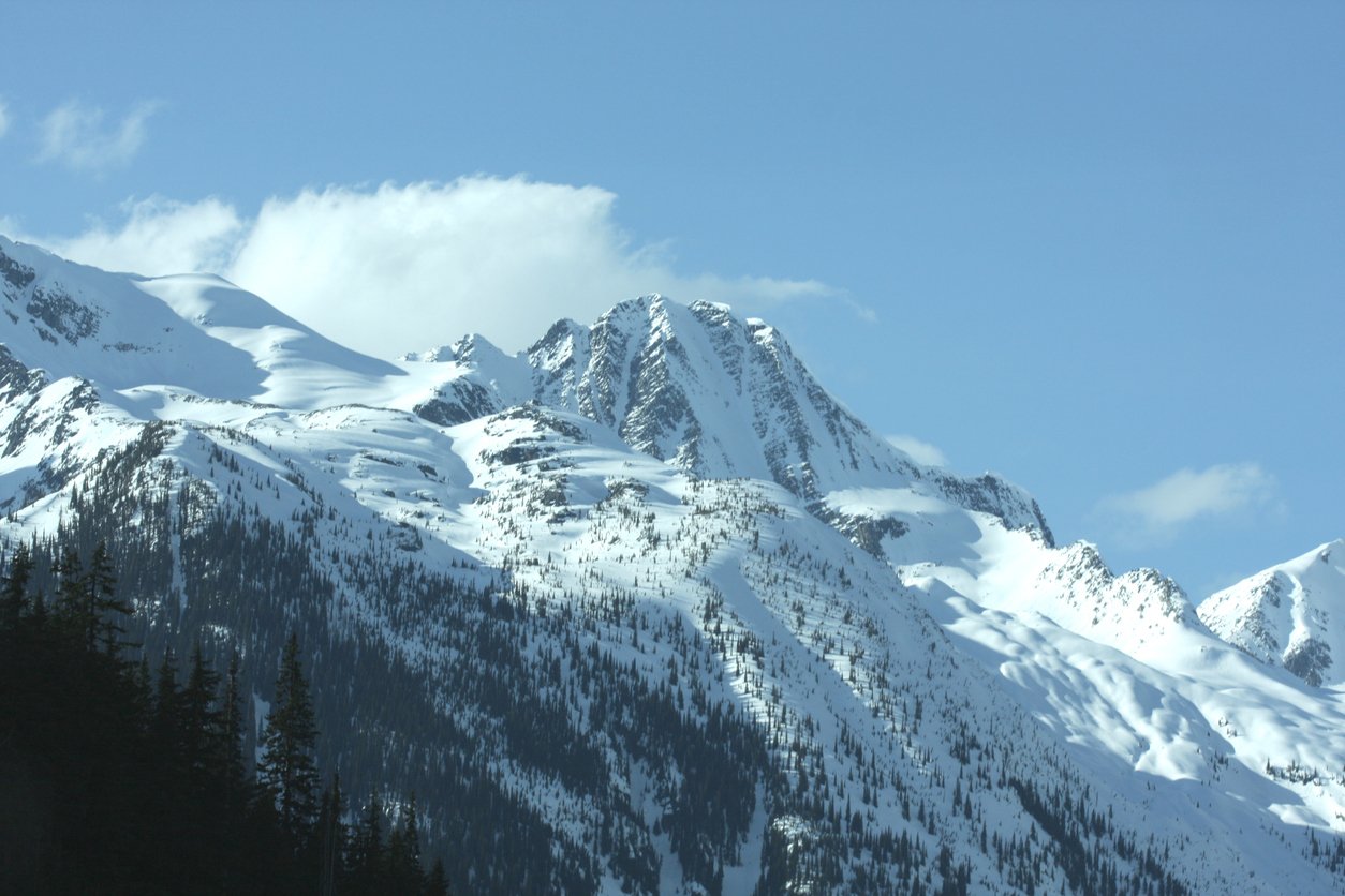 Selkirk Range, Rogers Pass, British Columbia, Canada in Spring. Snow cover. Rural scene.