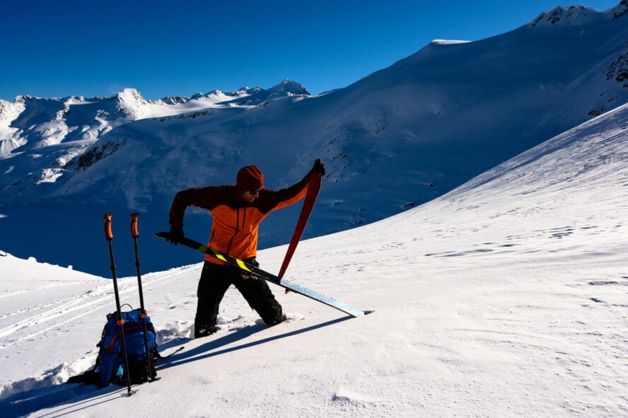 Once you’ve taken your skins off for the descent, fold them glue side to glue side and wrap them under your jacket to keep the glue warm and pliable. 