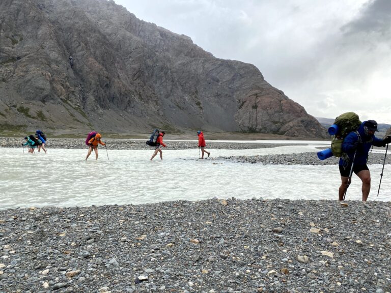 Crossing a river on the Huemul Circuit. Photo by Julian Lopez
