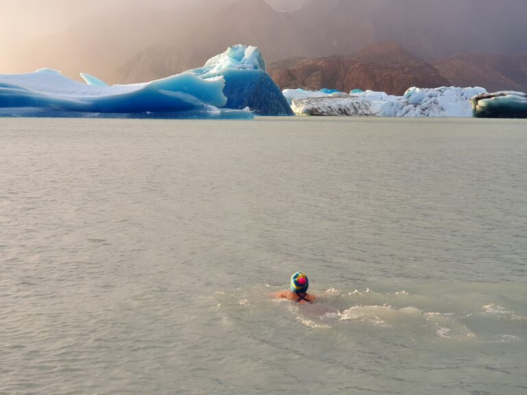 A swimmer in a glacial lake in Patagonia. Photo by Julian Lopez