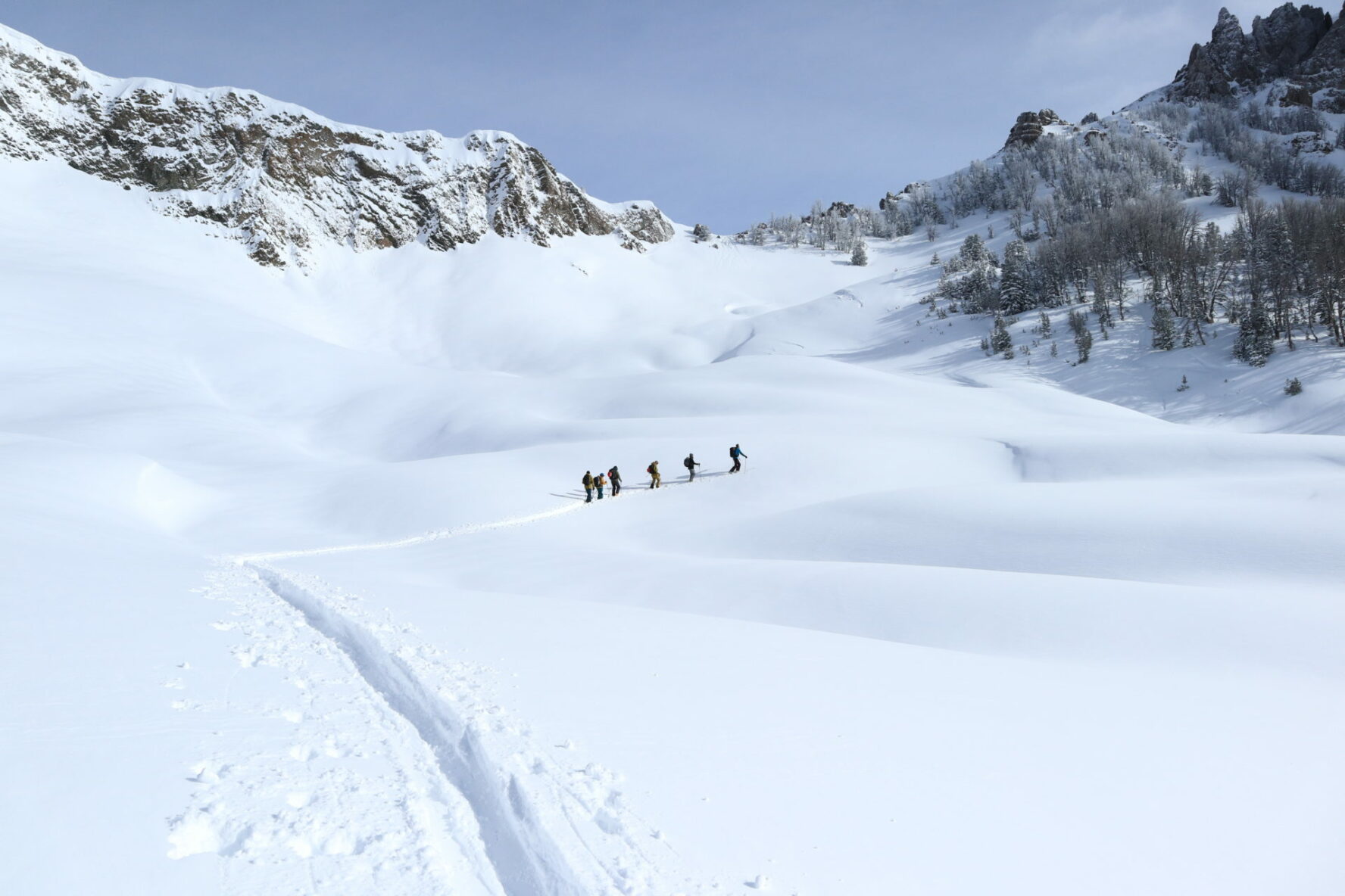 Skiers ascending a slope in Grand Teton National Park
