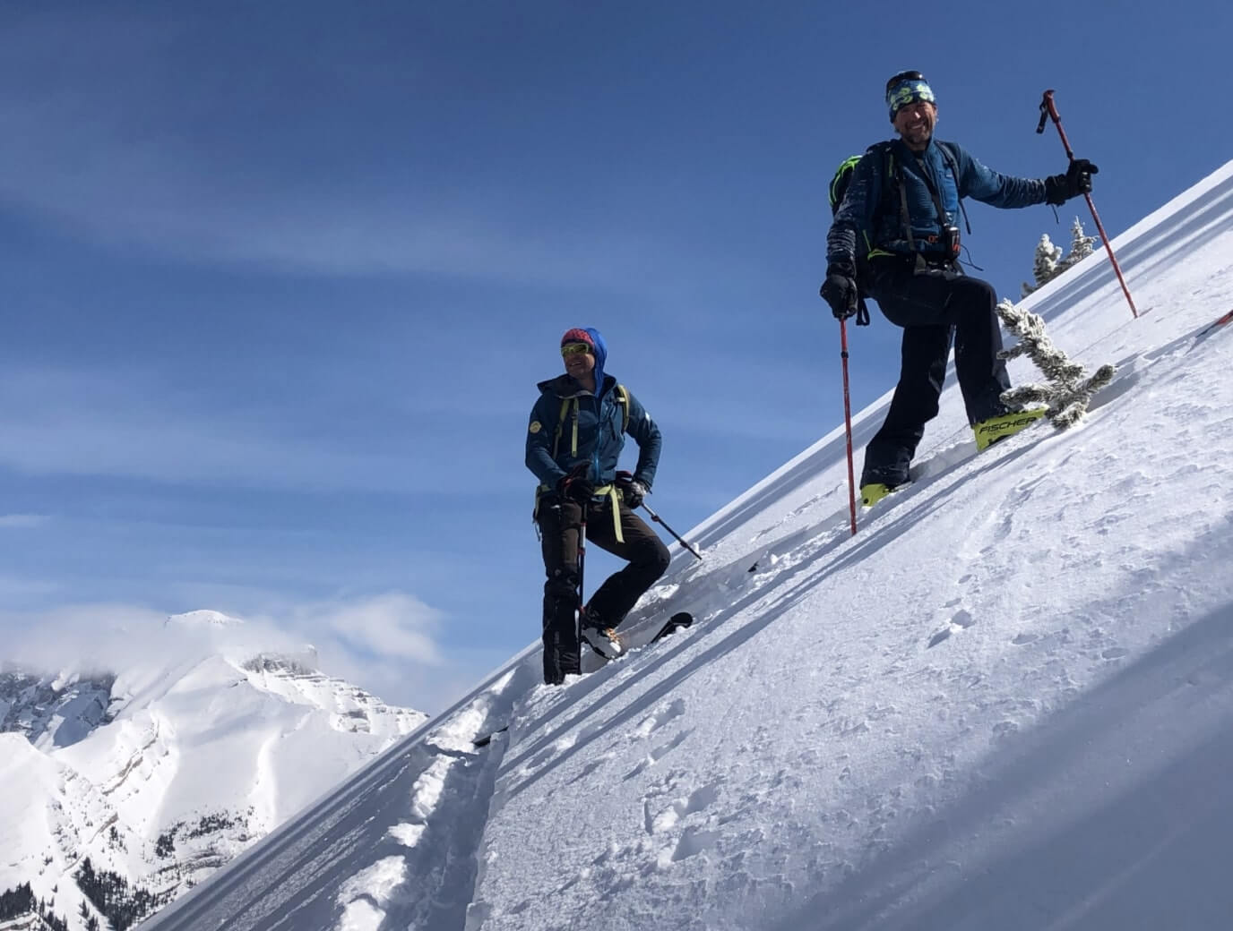 Skiers on a slope in the Canadian Rockies