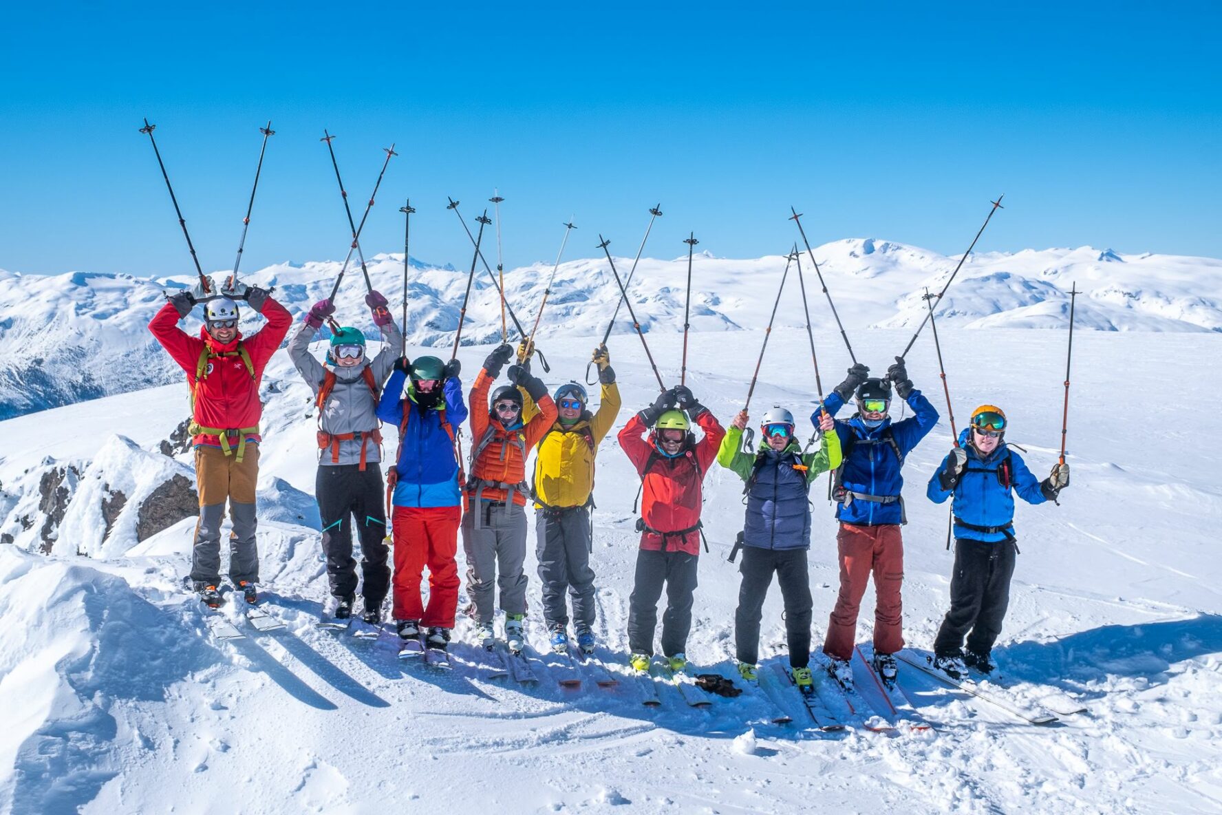 Skiers posing for a photo near Journeyman Lodge, BC.