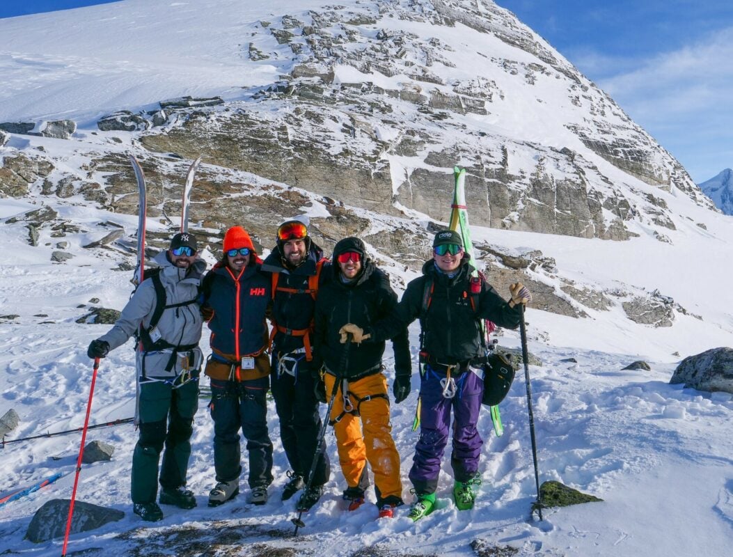 A group of backcountry skiers posing in the mountains near Revelstoke and Golden.