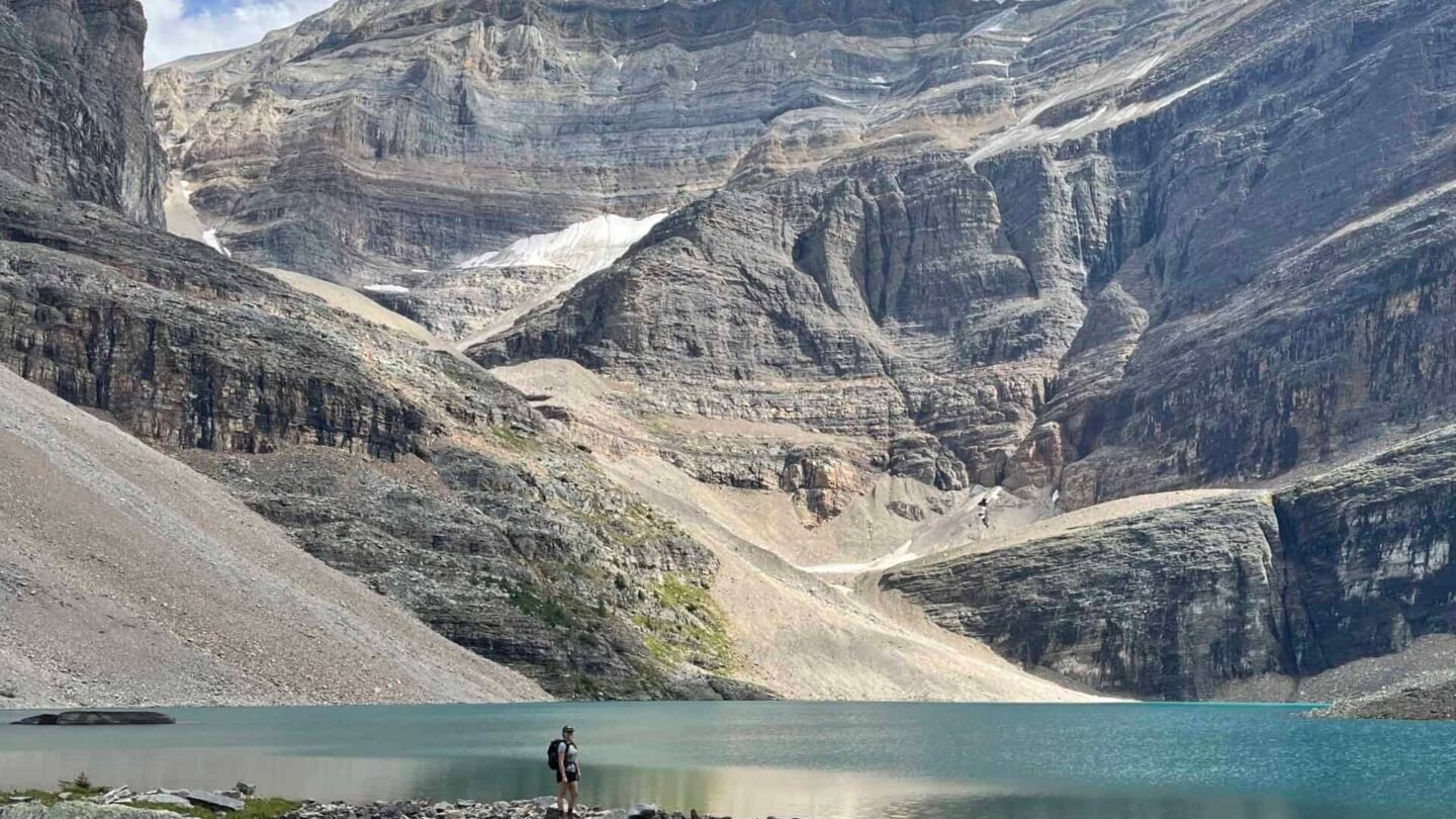 One hiker standing lake BC