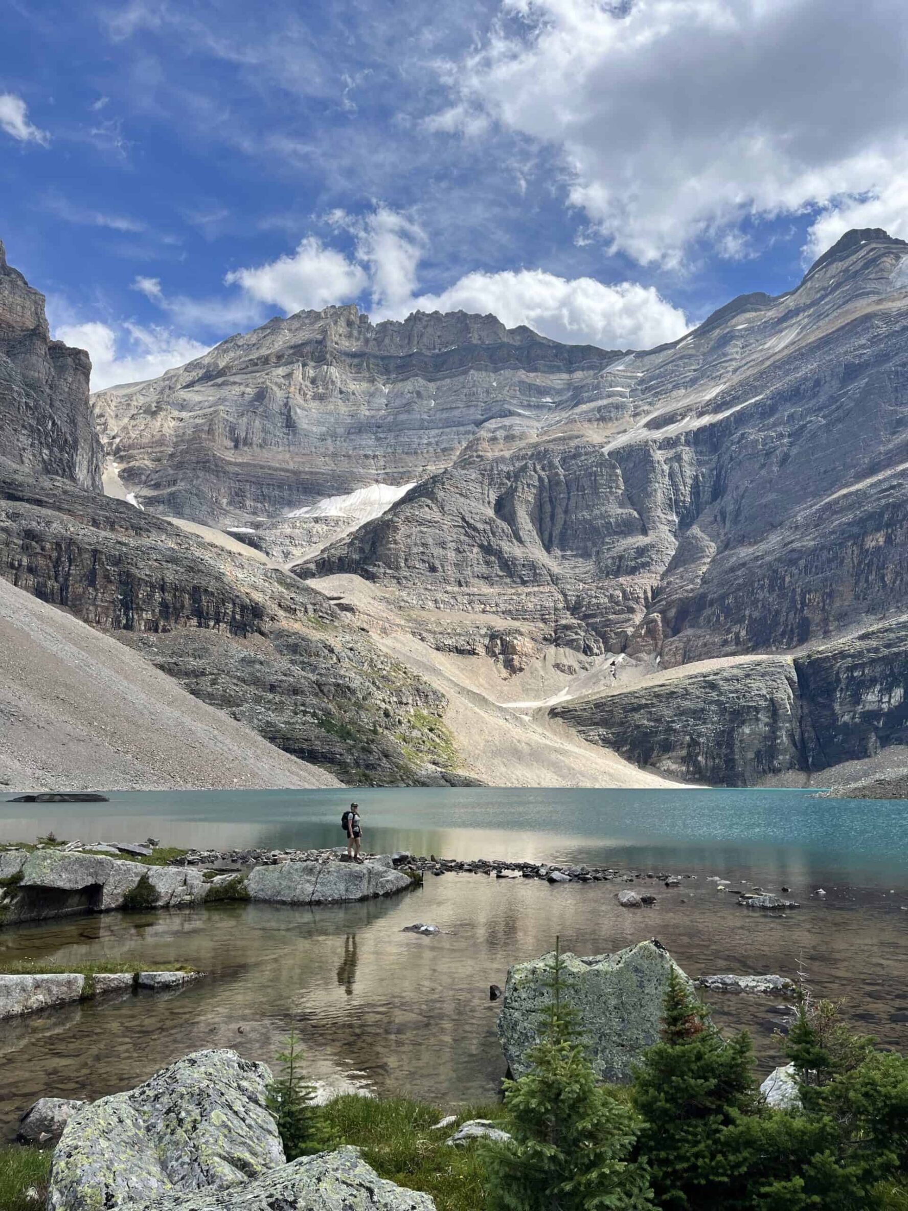One hiker standing lake BC