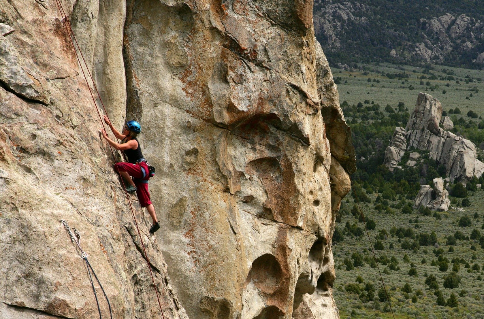 A woman climbing in City of Rocks