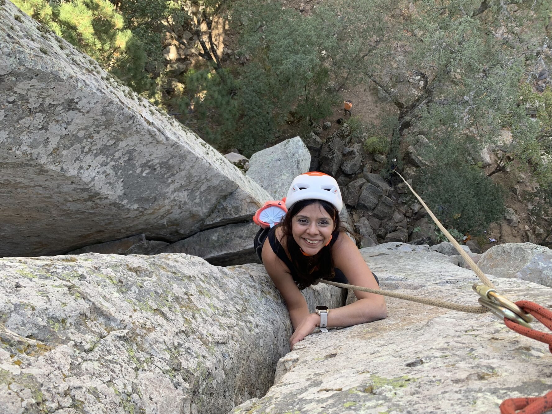 Climber climbing and smiling