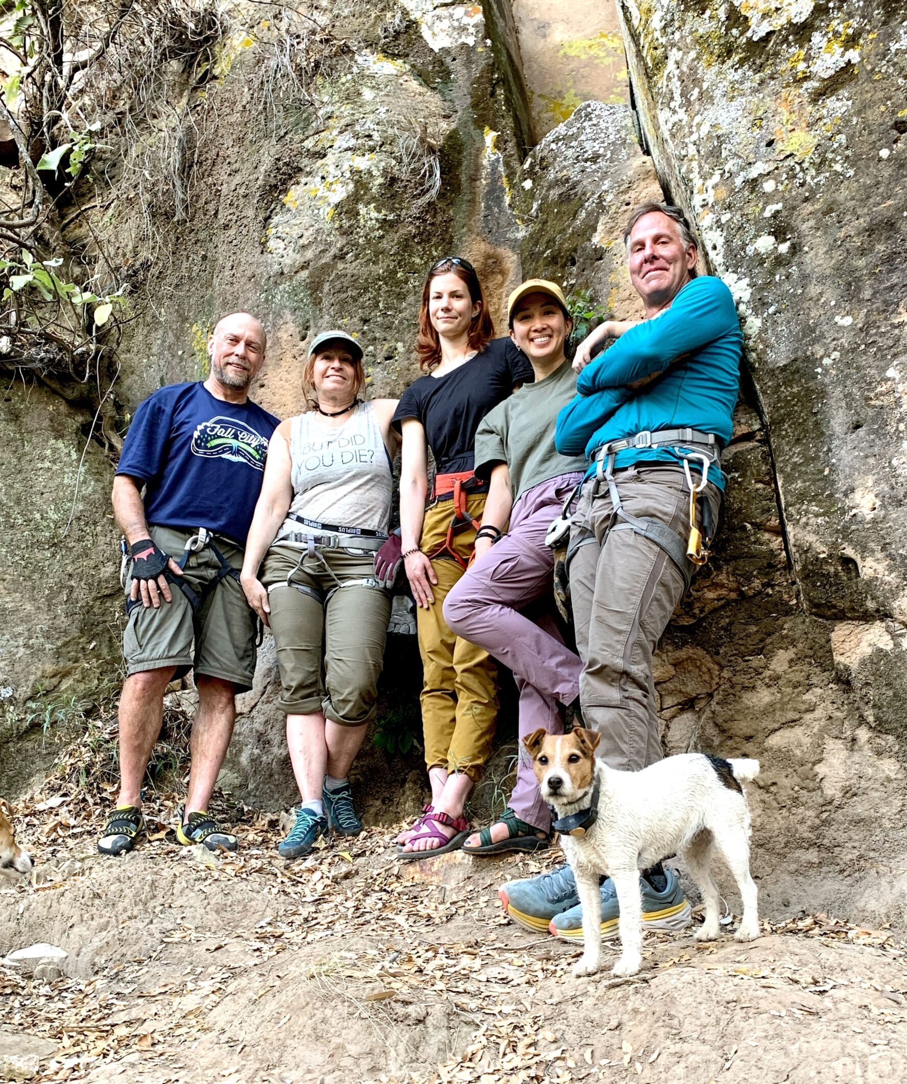 Climbers posing with a dog