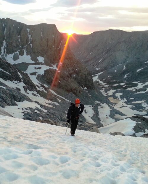 Beautiful sunrise while climbing the peak