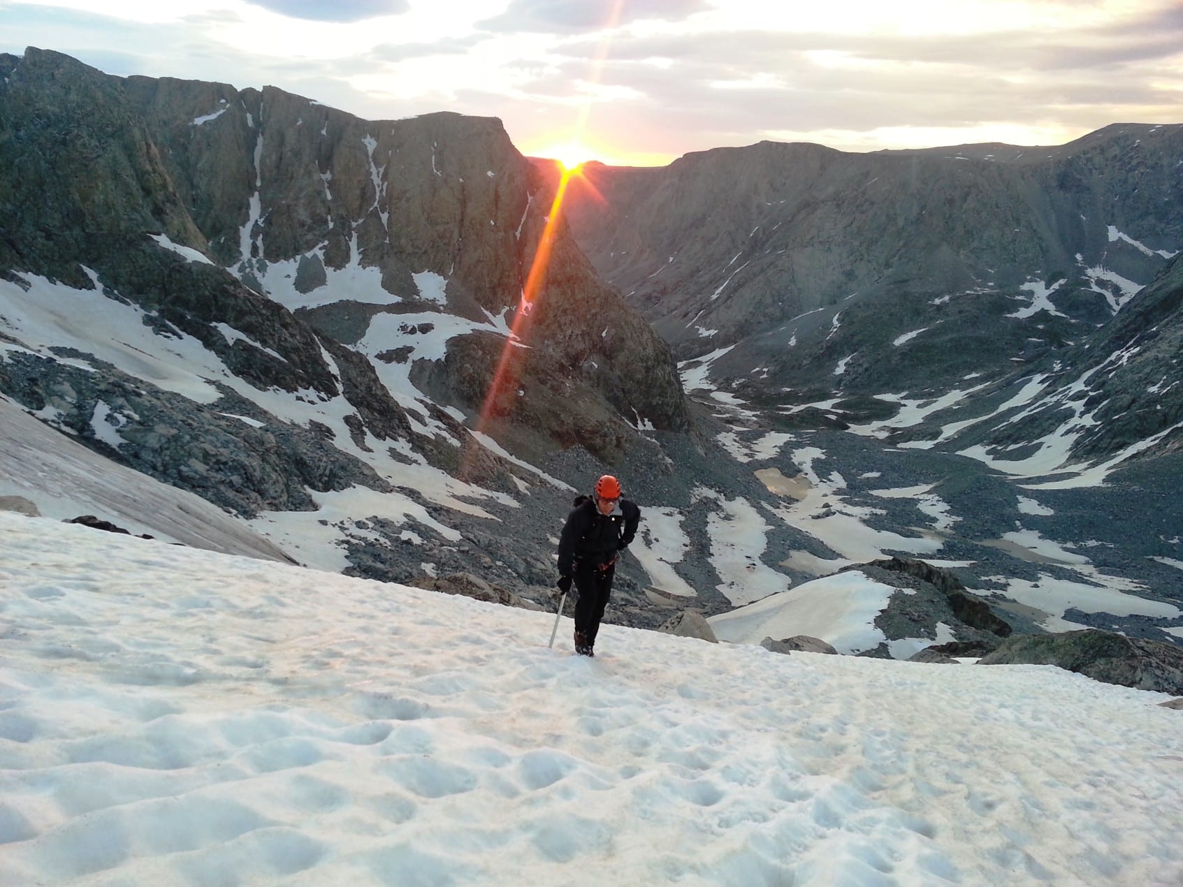 Beautiful sunrise while climbing the peak