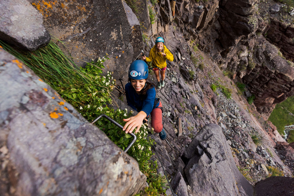 Climbers climbing the ladder in Telluride