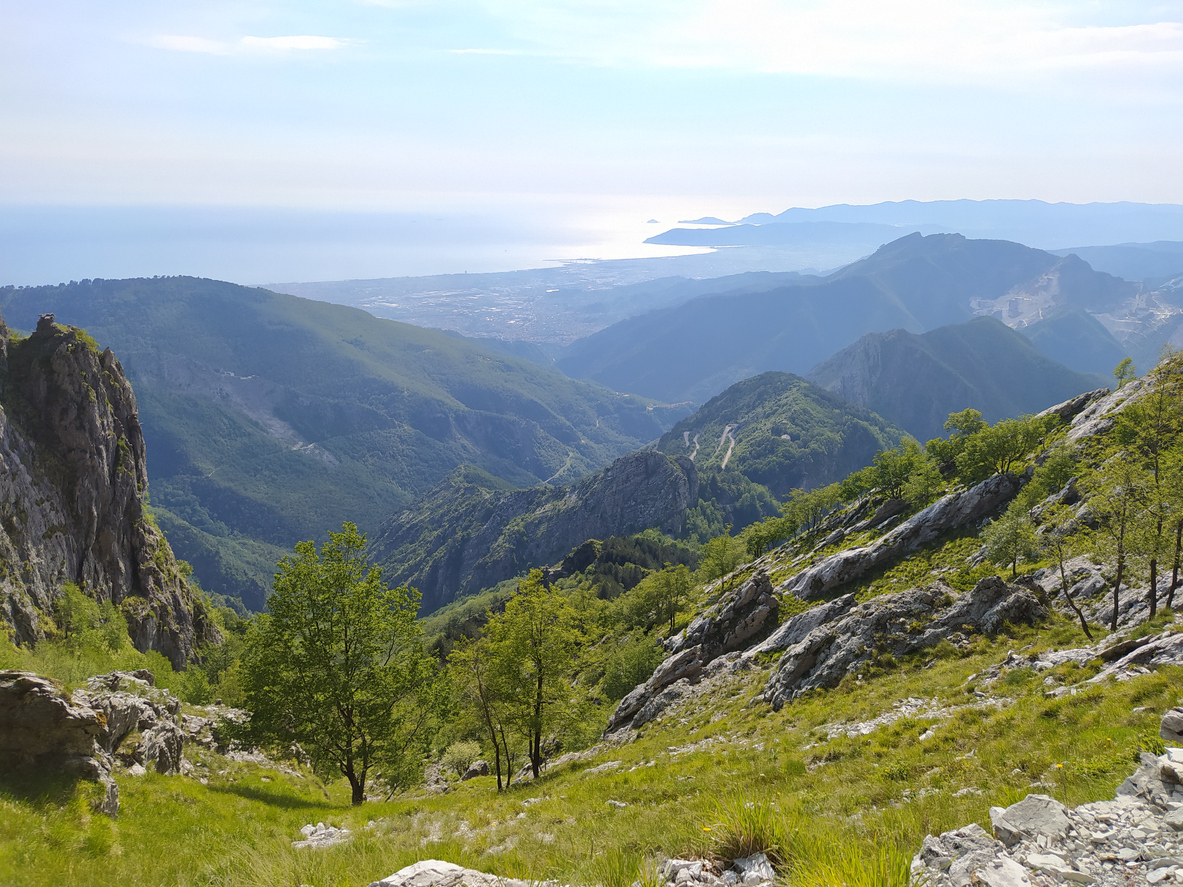 panorama towards the horizon among the wooded valleys on the Apuan Alps of the Tuscan Apennines in italy