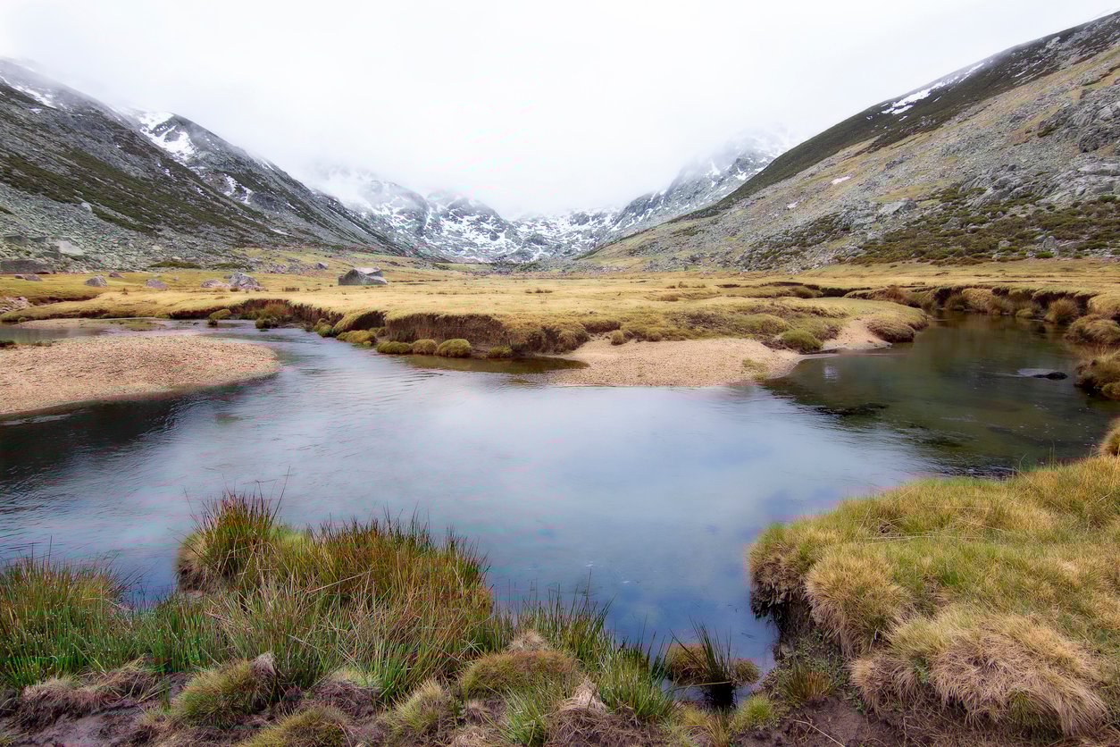 River, lagoon and mountain landscape. Hiking route through the Gredos circus, Avila. Spain