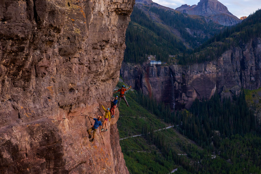 Hikers posing on a cliff