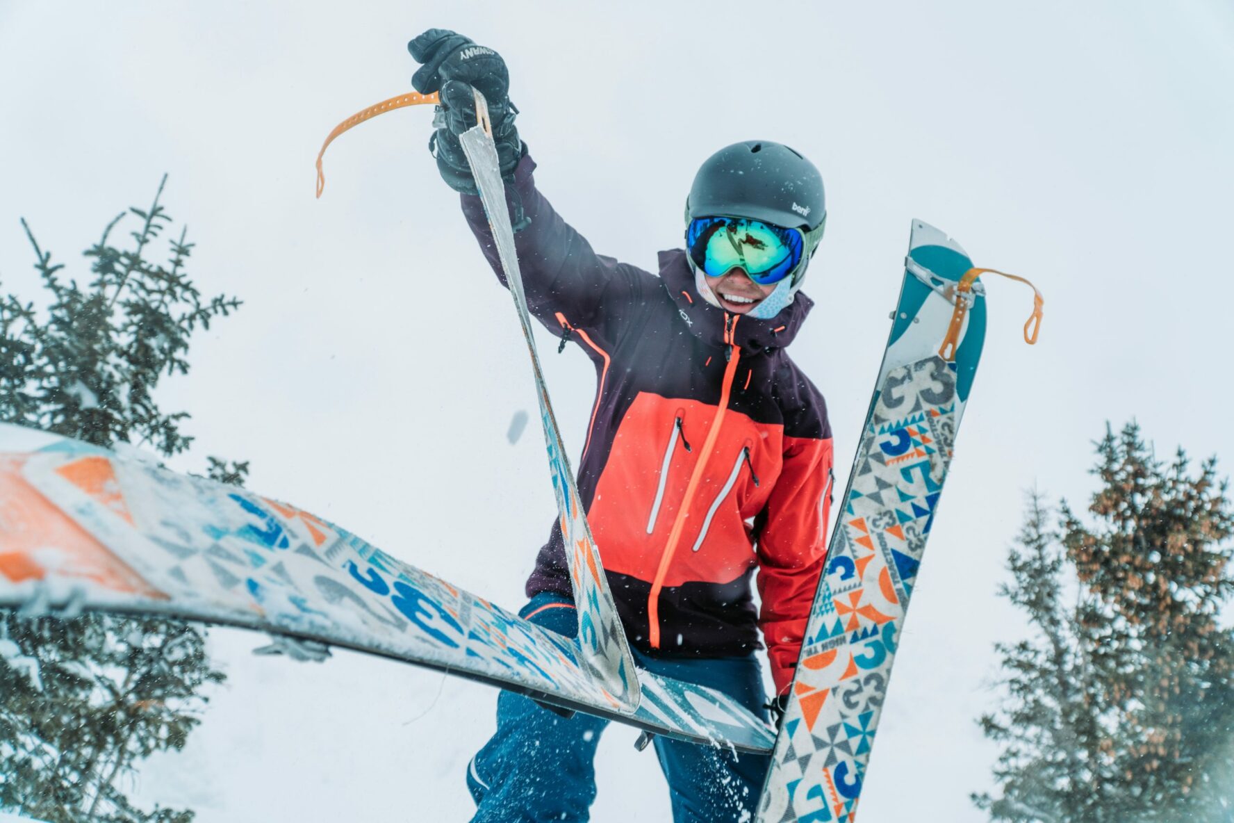 A skier removing skins from their skis