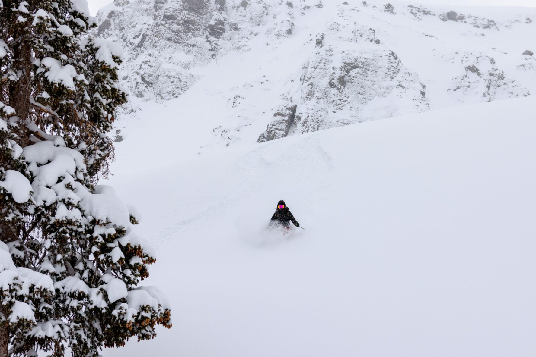 Skier barely seen from the snow