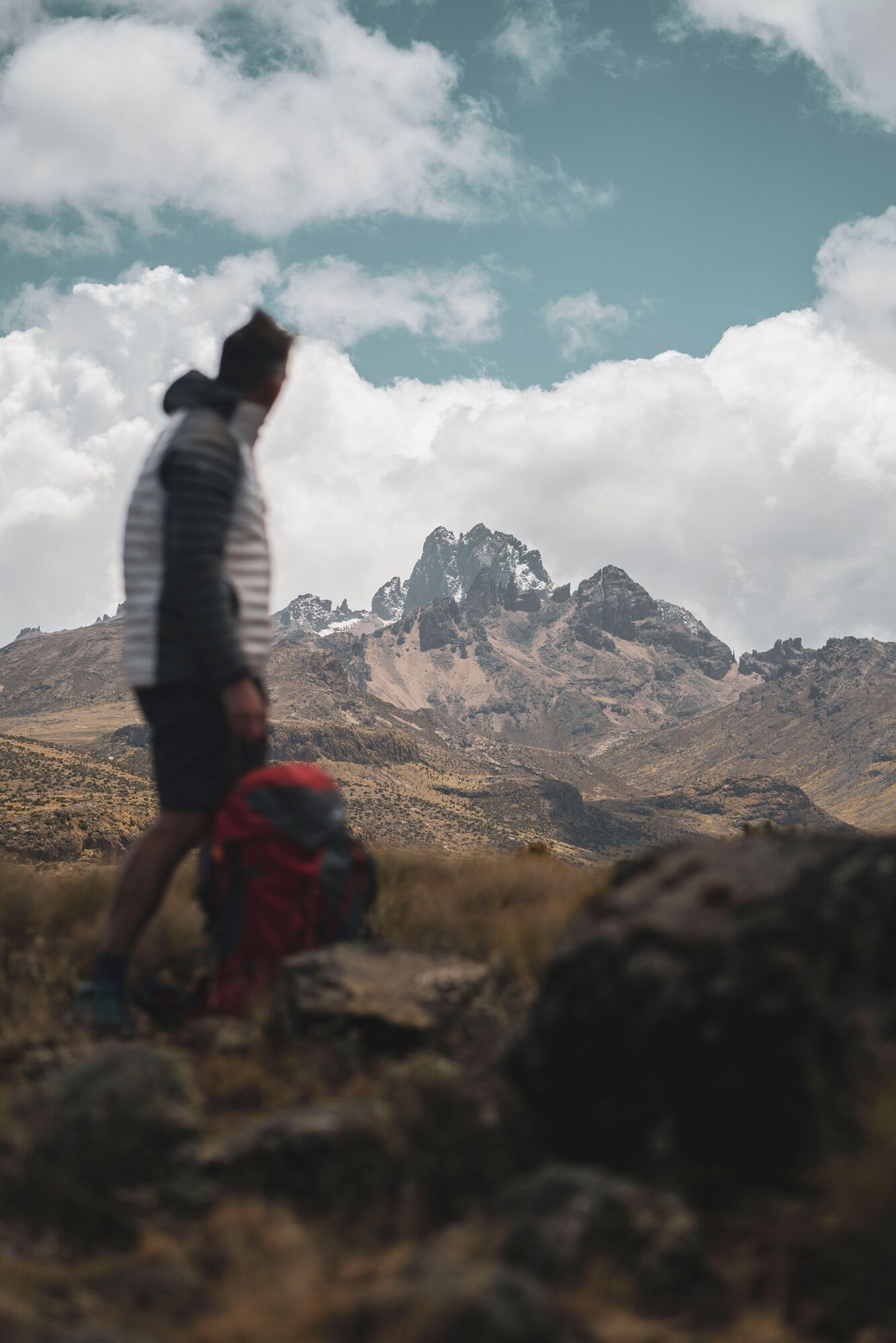 Hiker standing on some peaks on Mt. Kenya