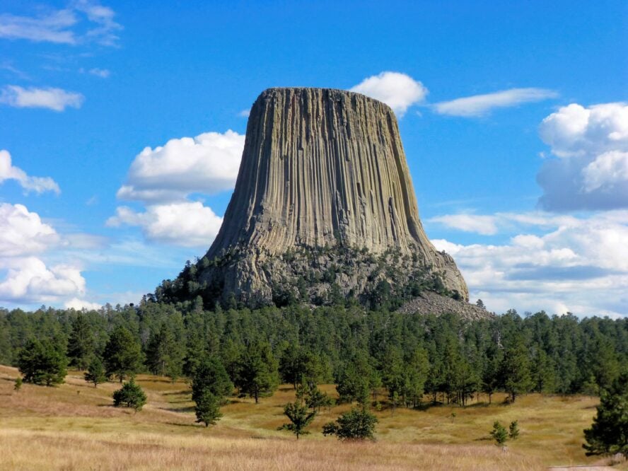 Devils Tower juts out like a tree stump from the rolling foothills and offers some of the best rock climbing in Wyoming