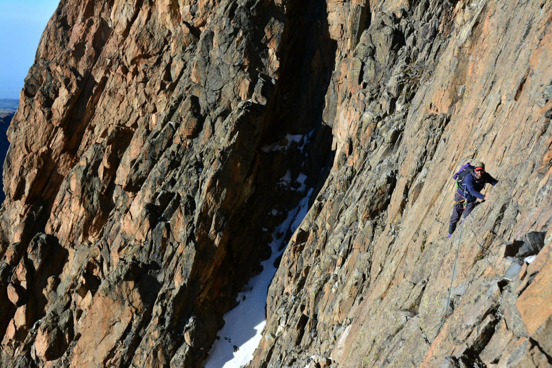 A climber on some cliffs near the Chogoria summit
