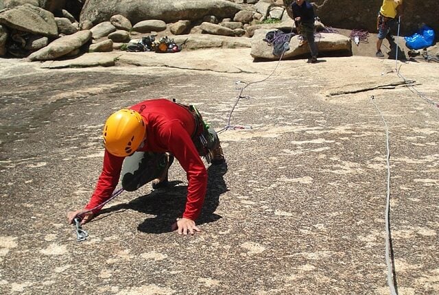 A group of people climbing La Pedriza.