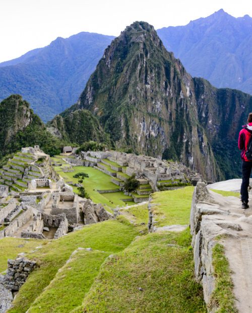 Woman standing in front of Machu Picchu