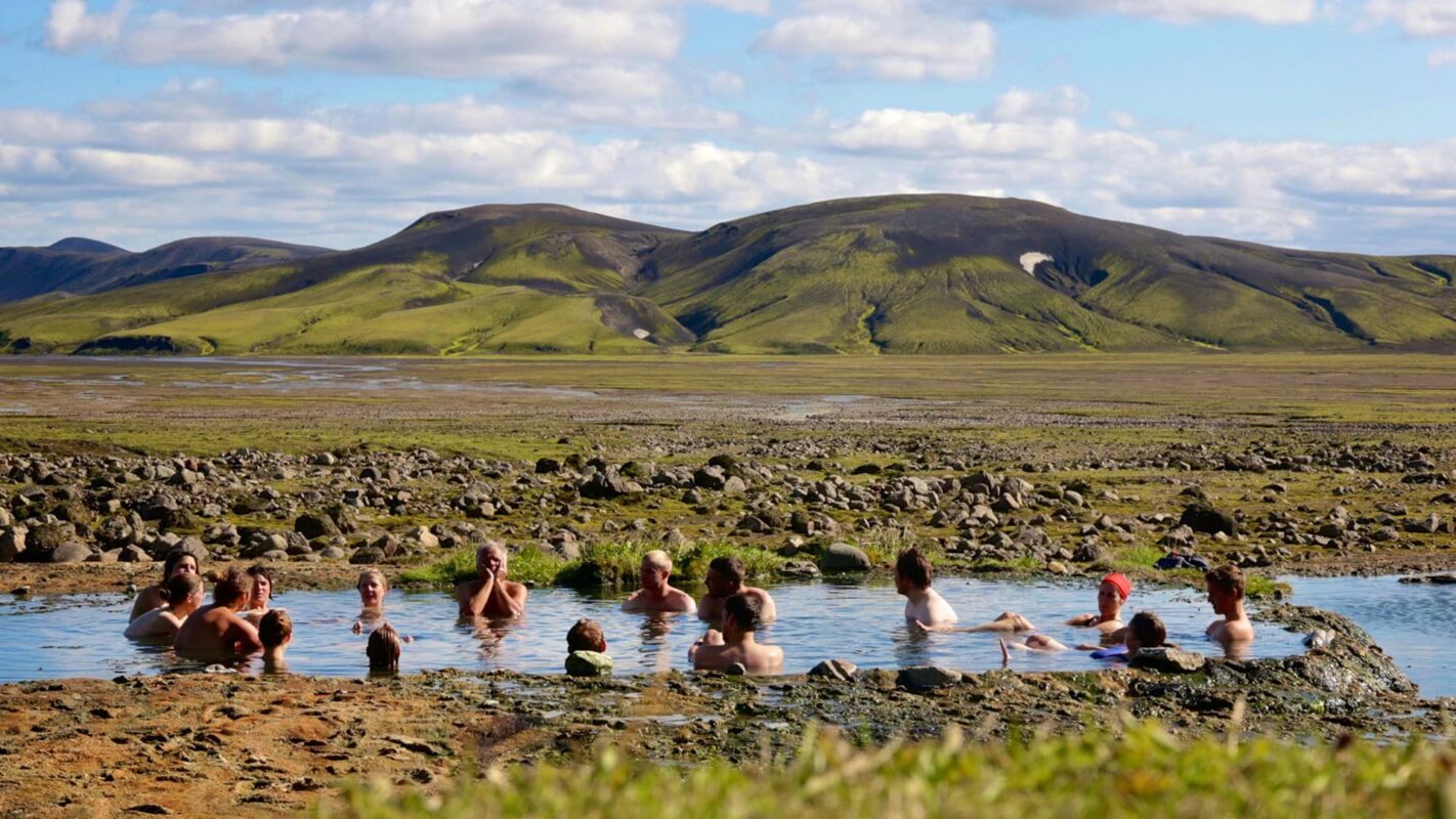 Hikers relaxing in one of Iceland’s natural pools