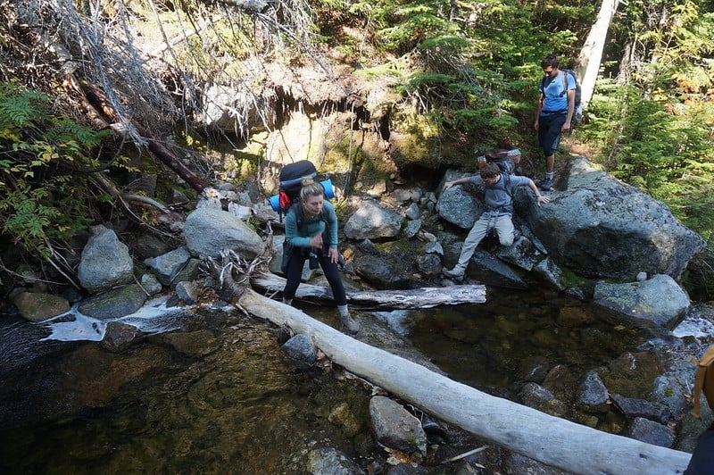 Hikers on a stream on the Presidential Traverse