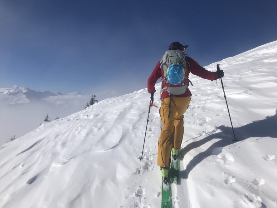 Climbing in the skintrack while the team discusses and evaluates options