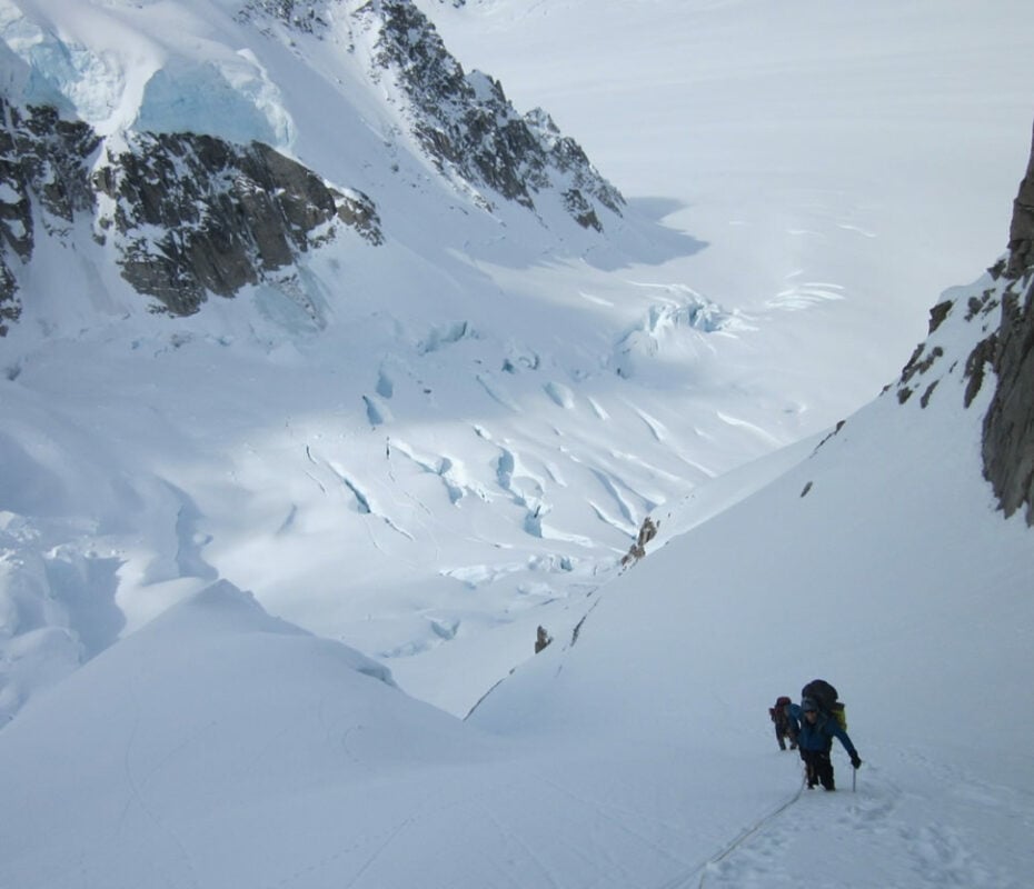 A mountaineer on a hill in the Alaska Range