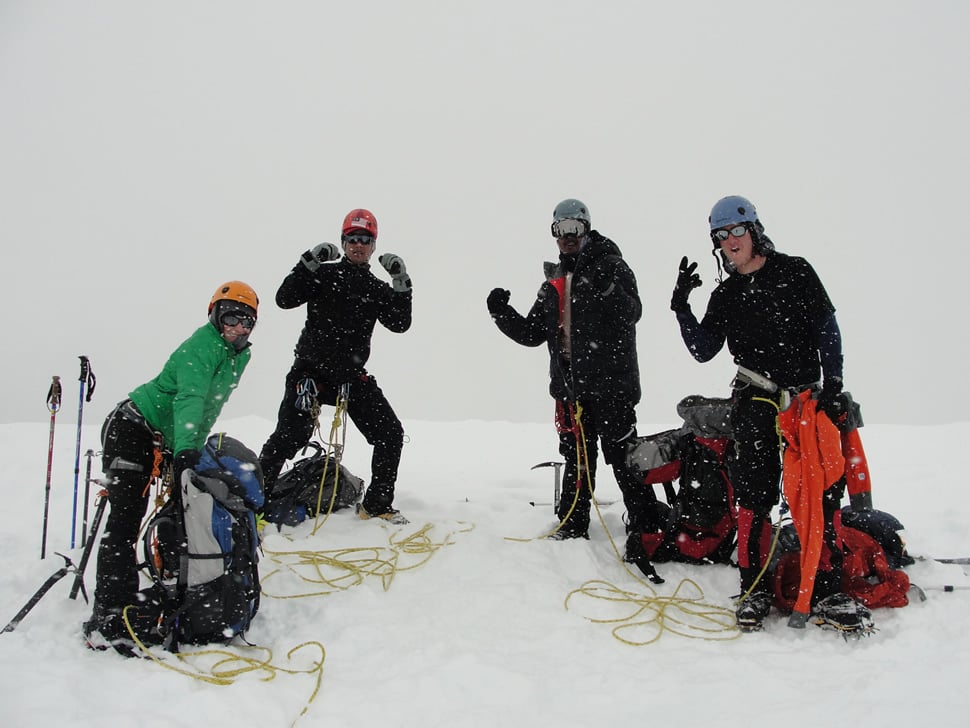 Mountaineers posing after a successful climb