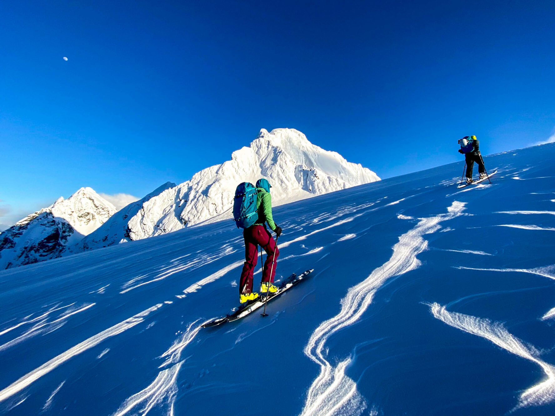 Tourers skinning uphill in the Tantalus Range.
