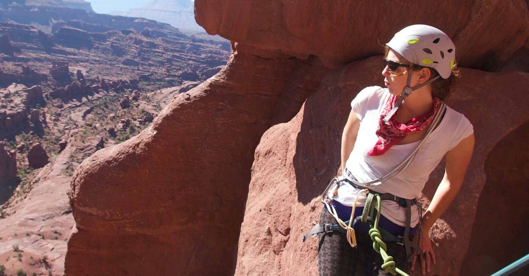 A climber standing on a tower mid-climb