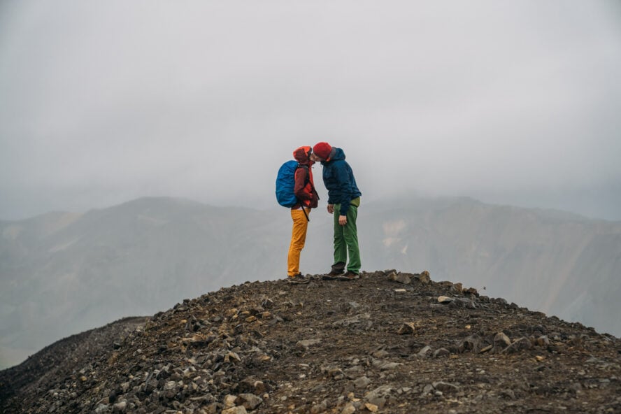 My girlfriend and I sharing a kiss while hiking on a Volcano in Iceland