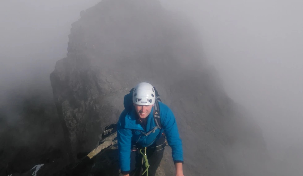 A climber in the fog in Cuillin Ridge