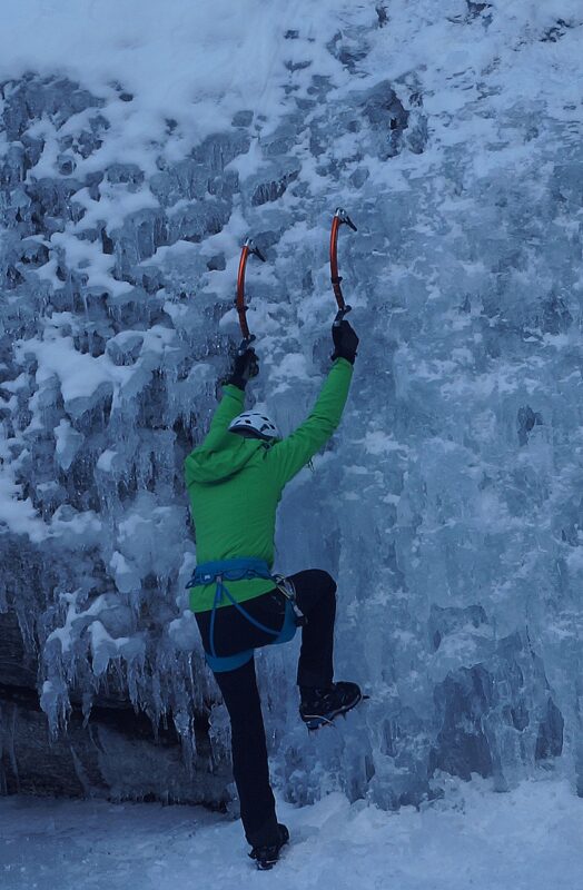 An ice climber climbing in Lillaz, Italy