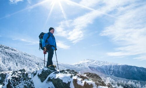 A mountaineer on a peak in New Hampshire