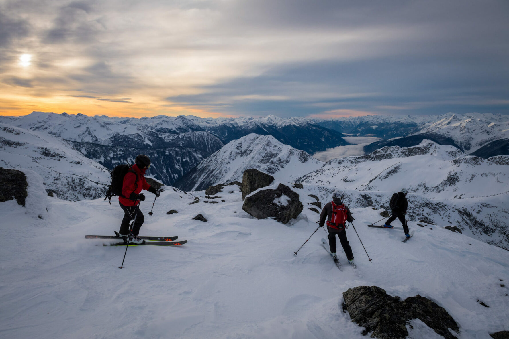 A group of tourers on a summit in the Tantalus Range