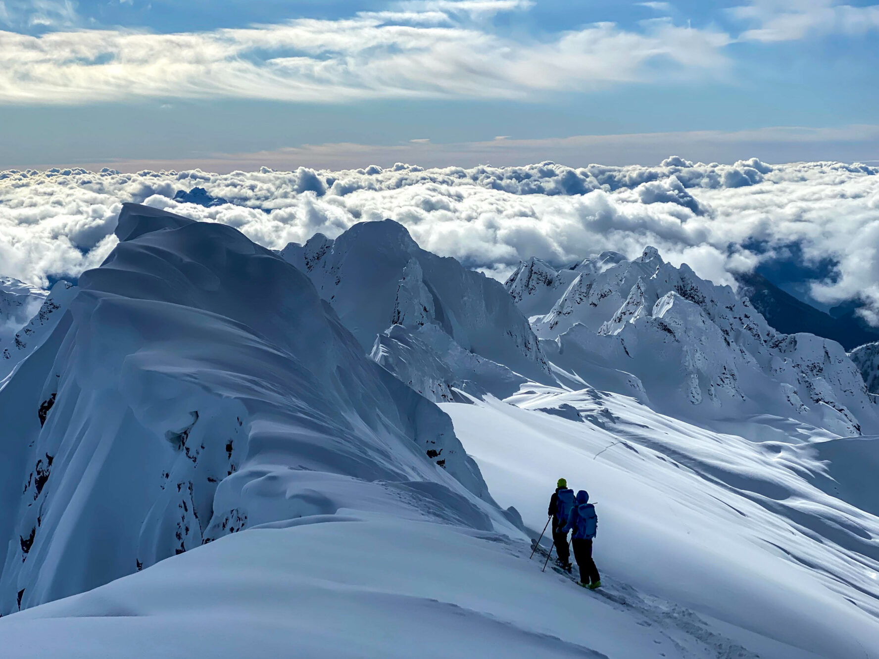 Ski tourers enjoying the views from the Tantalus Range.